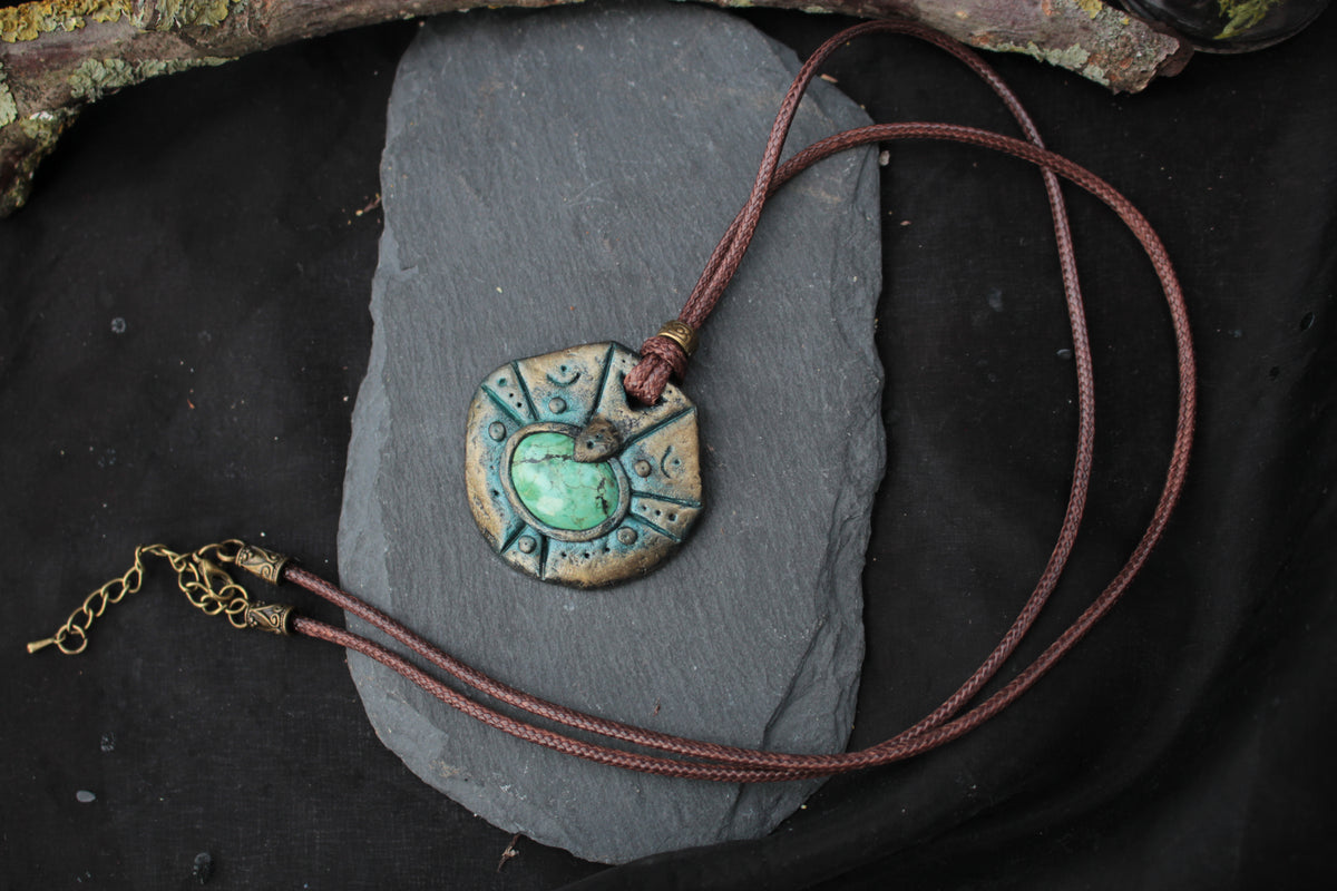 Handmade fantasy pendant showing its approximately 4.2 cm width and 4 cm height