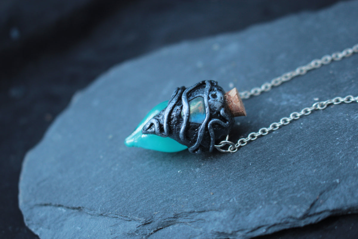 Fantasy bottle necklace with turquoise glass vial and bronze details
