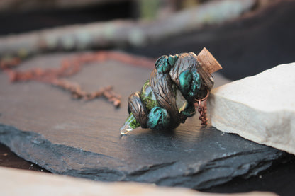 Woodland-inspired fantasy necklace featuring a tiny potion bottle pendant
