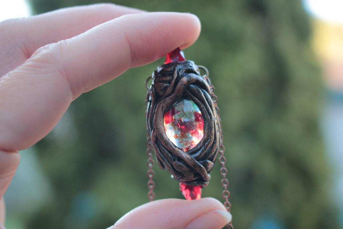 Unique RPG-inspired necklace with red crystals and an enchanted artifact aesthetic