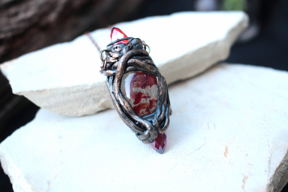 Unique fantasy necklace with deep red crystals and an antique-inspired design