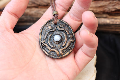 Handmade pendant designed to resemble an ancient magical relic