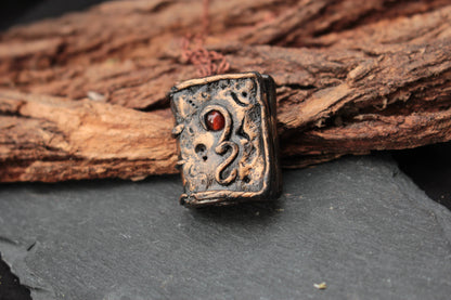 Detailed fantasy spellbook pendant necklace made from polymer clay