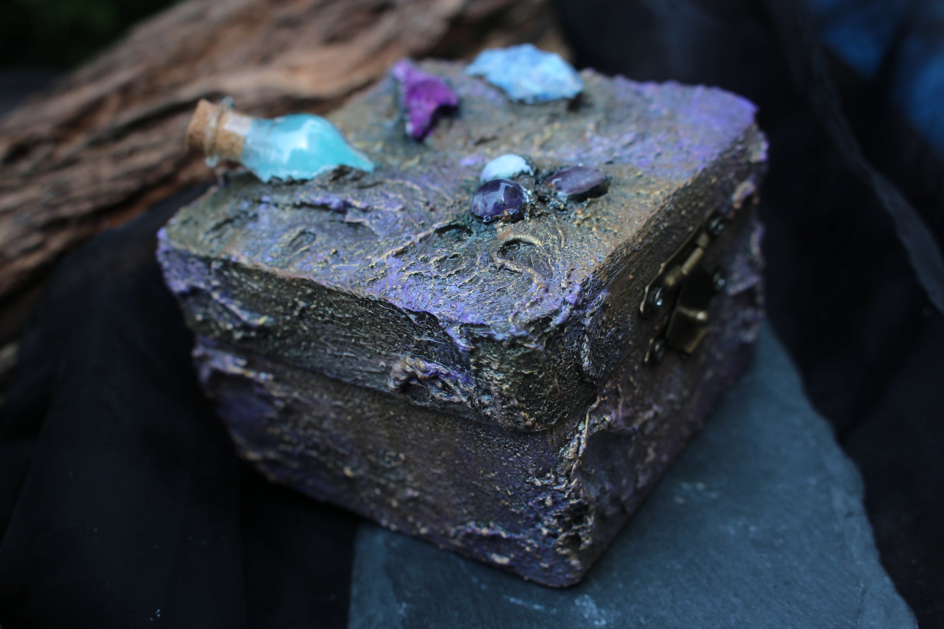 Fantasy wooden chest with miniature glass potion vial