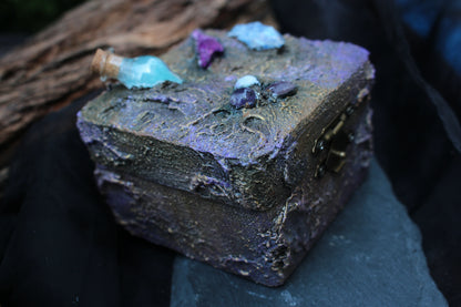 Fantasy wooden chest with miniature glass potion vial