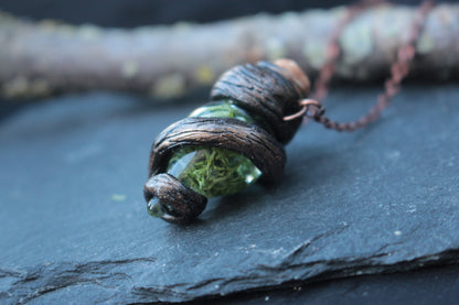 Green vial necklace inspired by ancient forests and hidden magical essences