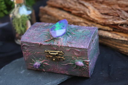 Handmade wooden box with glowing purple resin crystal