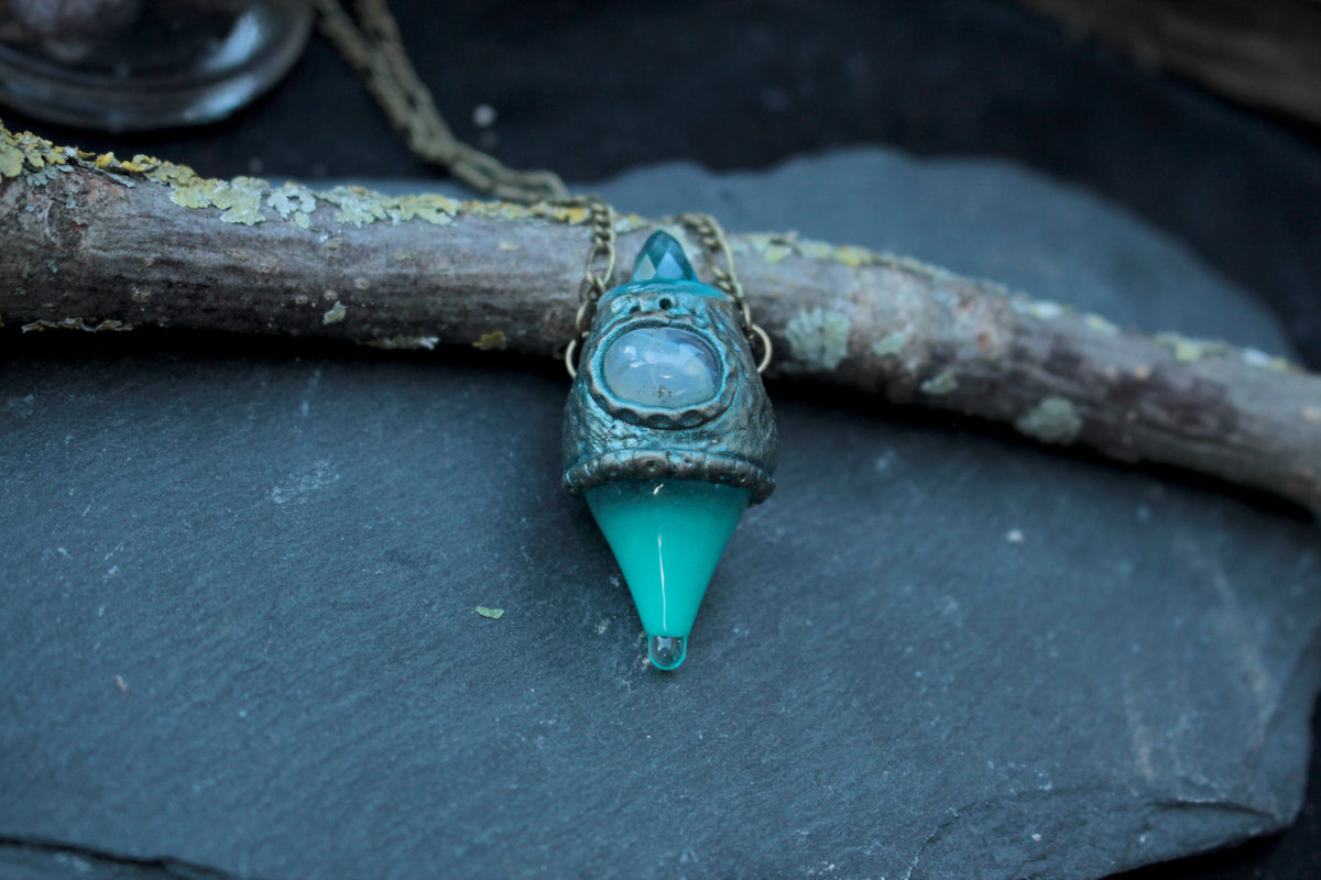 Fantasy pendant necklace with a turquoise glow and mystical potion design