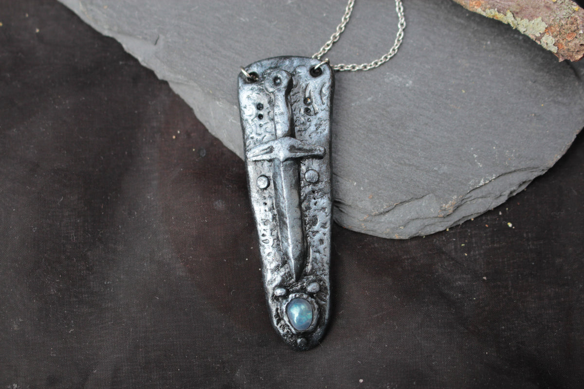 Gothic-inspired handmade sword necklace with metallic details