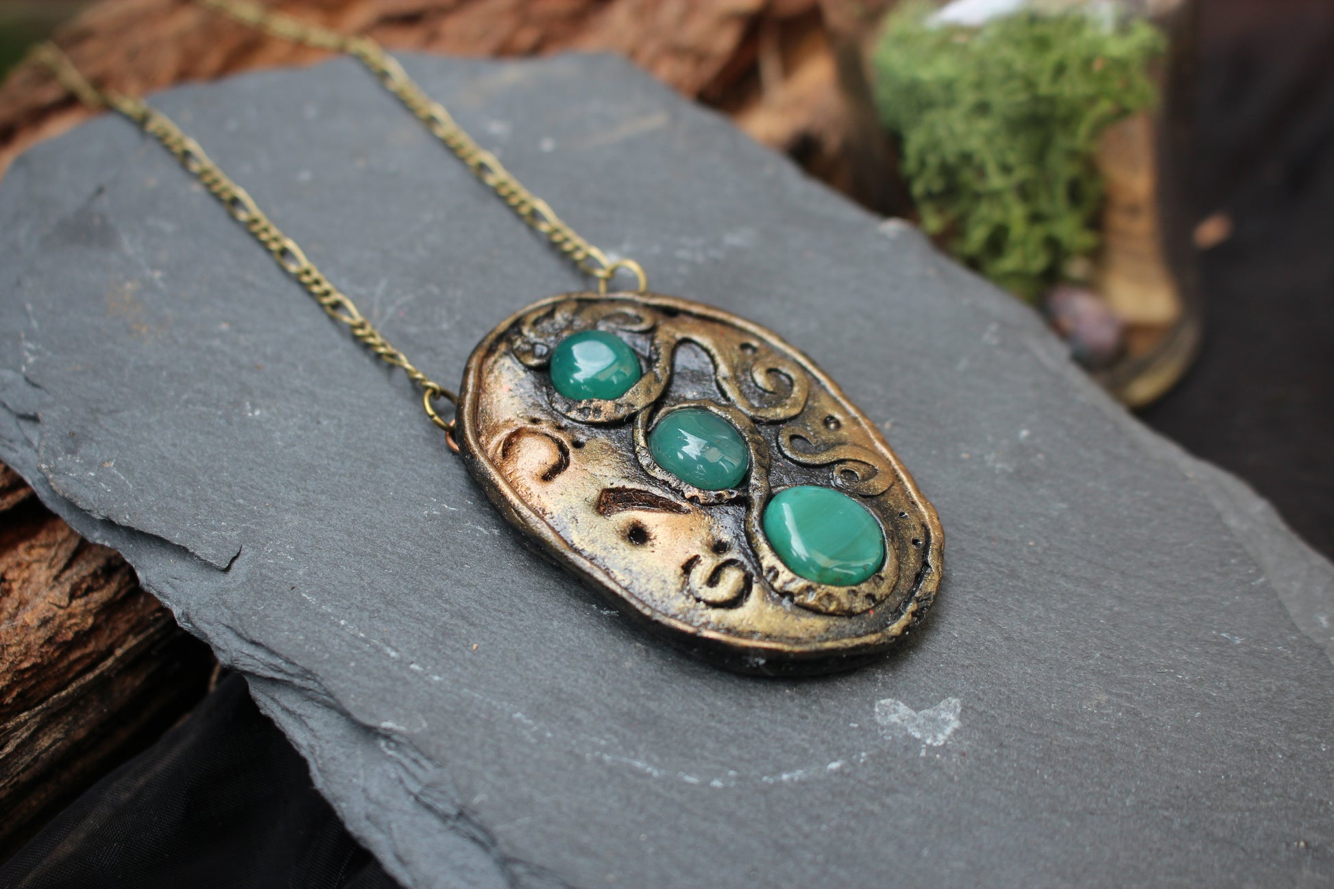 Rustic fantasy pendant with natural green agate gemstones and rune symbols