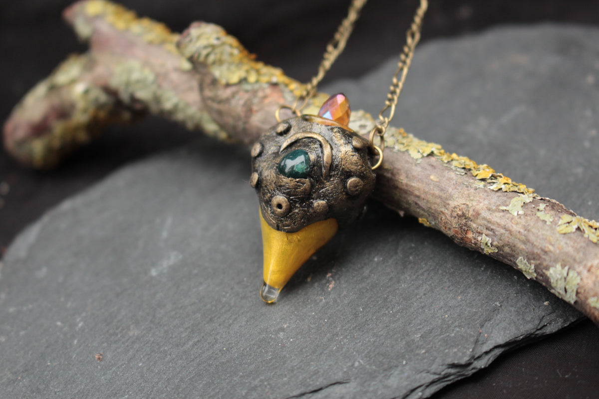 Green tourmaline gemstone set in a handmade fantasy forest pendant