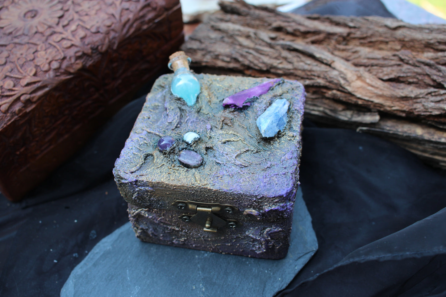 Handcrafted magical wooden keepsake box with glowing potion vial