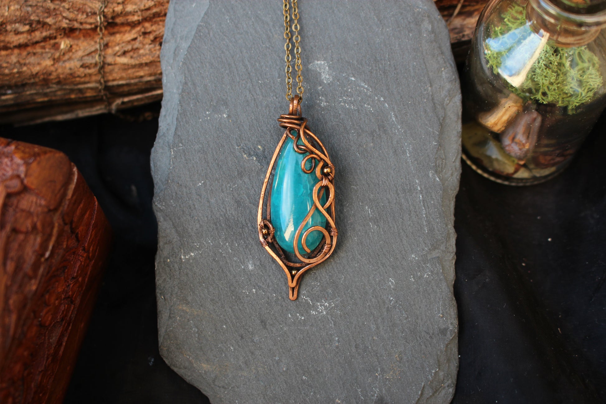 Artisan blue agate crystal jewelry featuring elegant copper wire craftsmanship