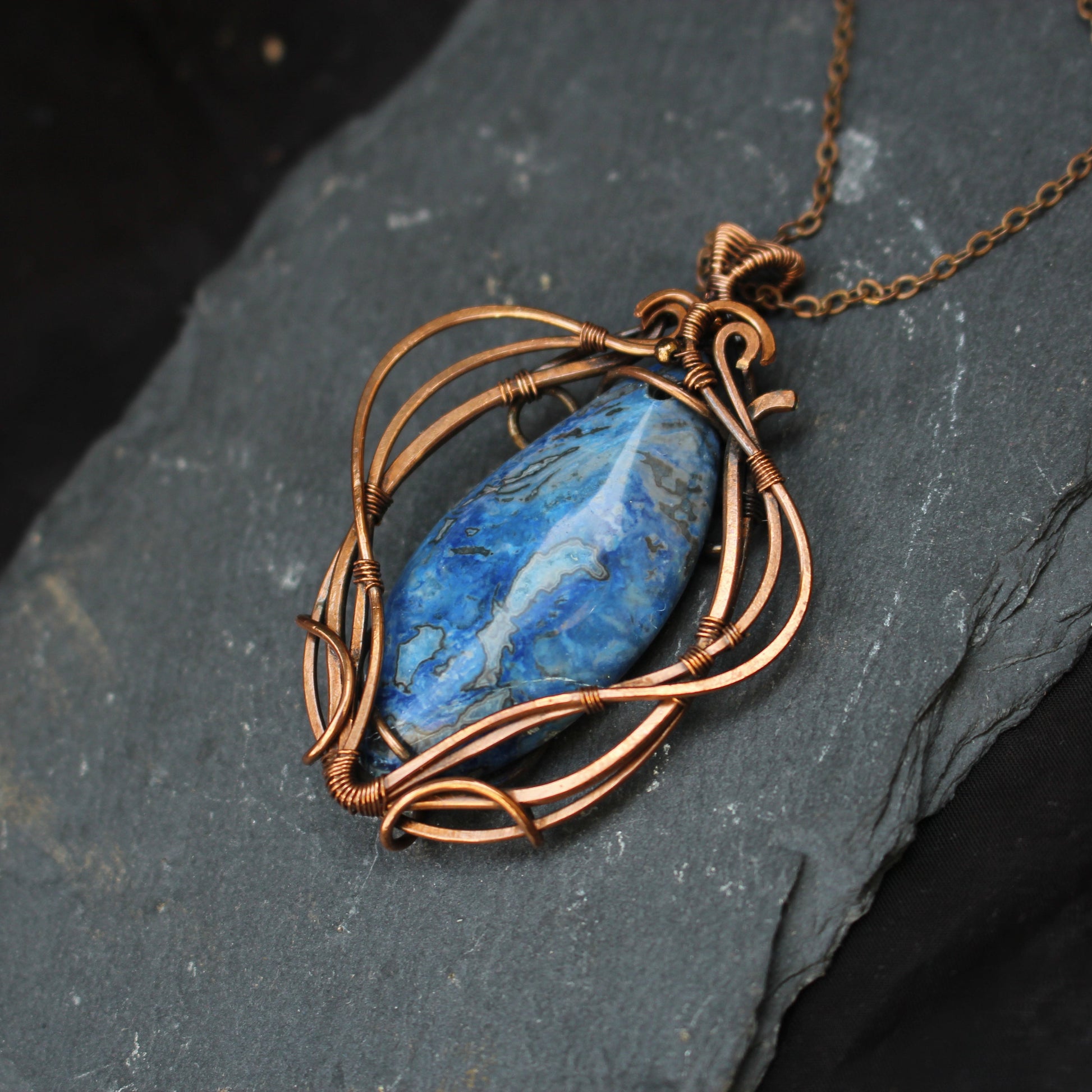 Handmade blue crazy agate copper wire wrapped pendant with artisan craftsmanship