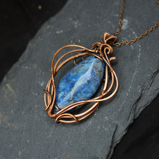 Handmade blue crazy agate copper wire wrapped pendant with artisan craftsmanship