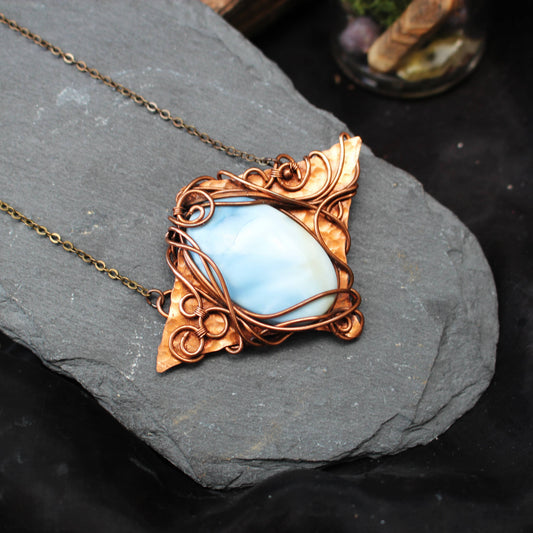 Blue opal gemstone pendant wrapped in copper wire handcrafted necklace