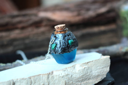 Handmade polymer clay blue potion pendant with glass and resin details