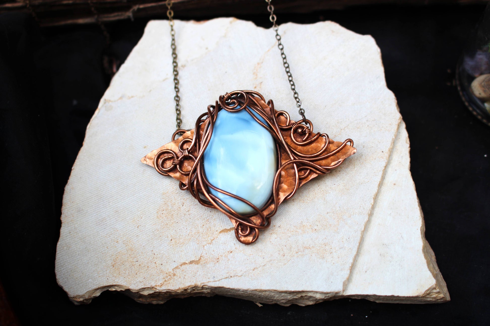 Unique handmade copper wire pendant featuring blue opal stone