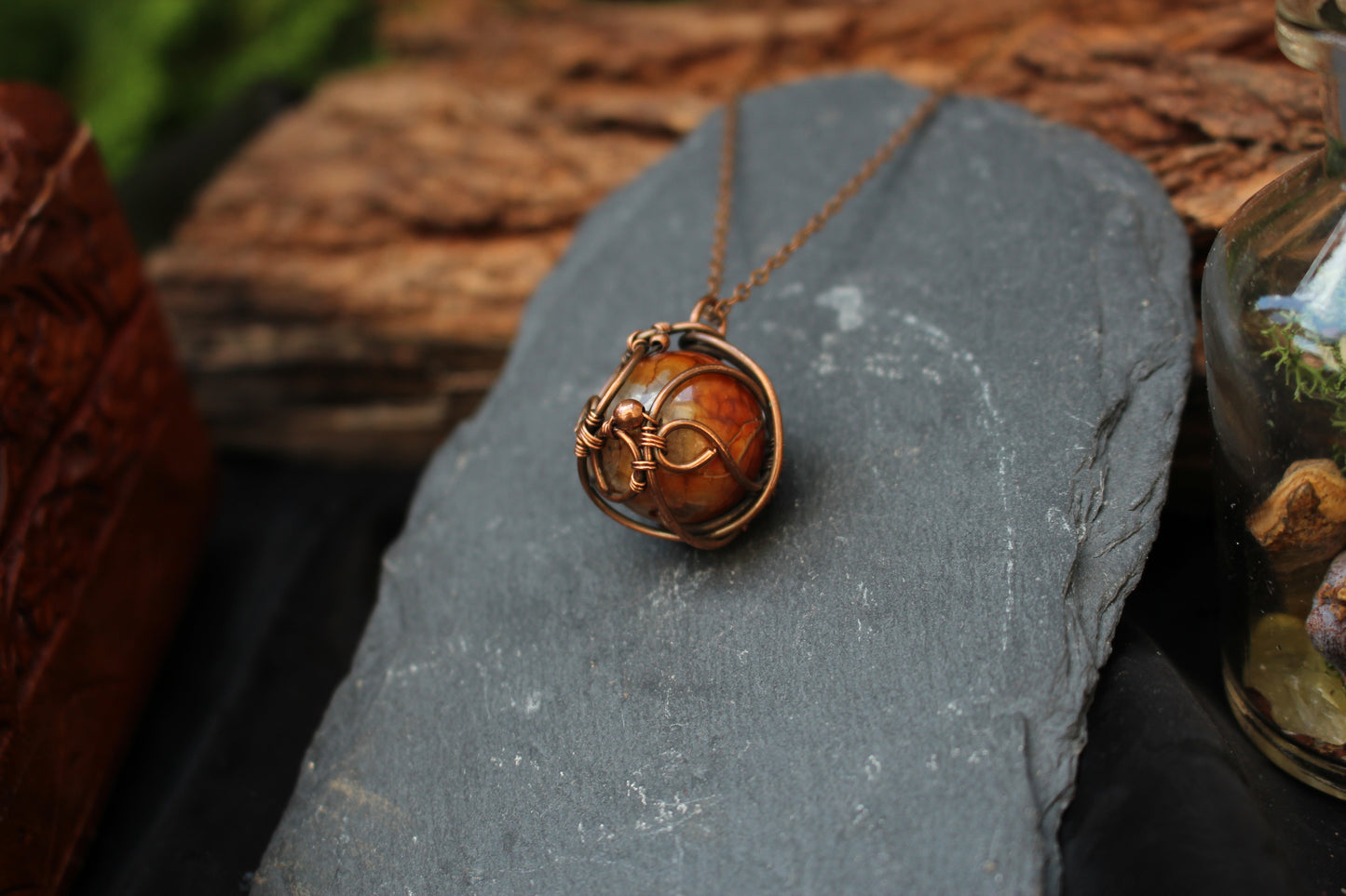 Artisan dragon vein agate gemstone pendant wrapped in copper wire
