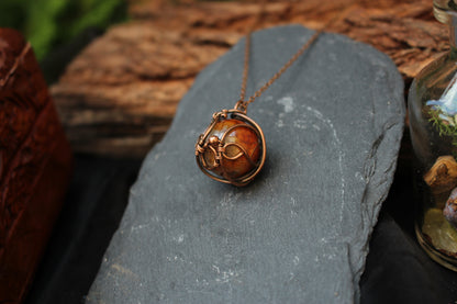 Artisan dragon vein agate gemstone pendant wrapped in copper wire