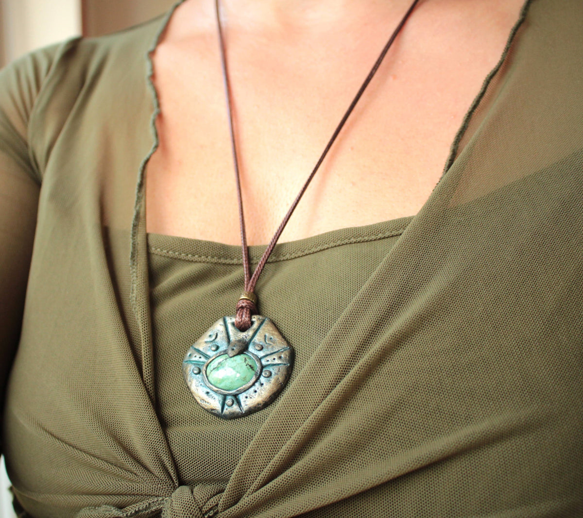 Detailed polymer clay pendant with metallic antique patina finish and protective coating