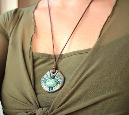 Detailed polymer clay pendant with metallic antique patina finish and protective coating