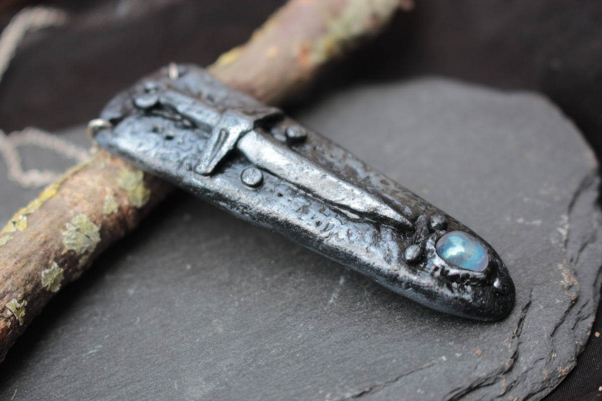 Handmade fantasy sword amulet with gemstone and metallic finish