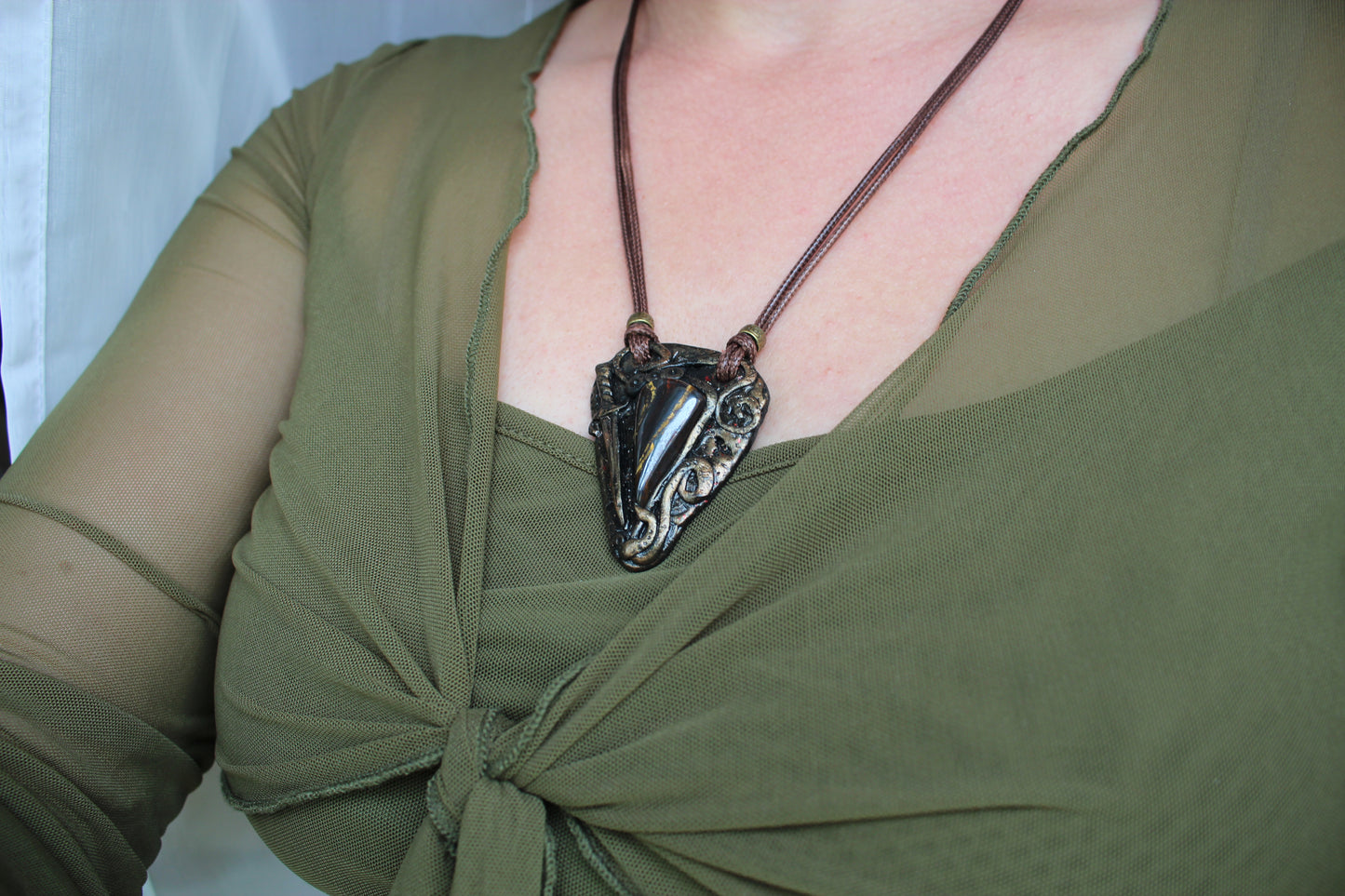 Handmade warrior talisman pendant with waxed cord