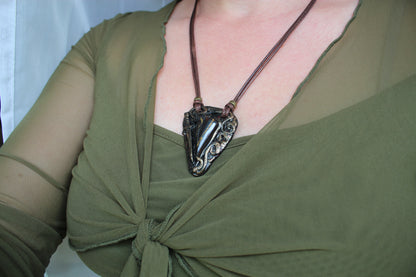 Handmade warrior talisman pendant with waxed cord