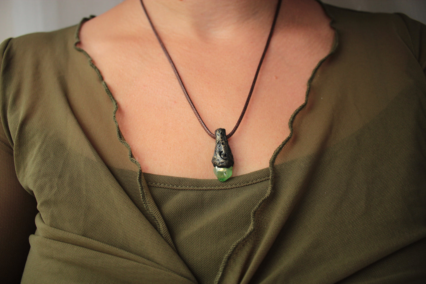 Unique woodland fantasy necklace crafted with an enchanting green crystal