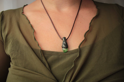 Unique woodland fantasy necklace crafted with an enchanting green crystal