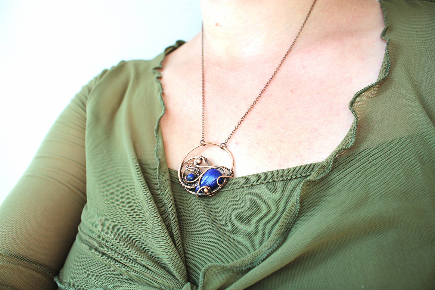 Boho style artisan necklace with natural stone and copper wire wrapping design