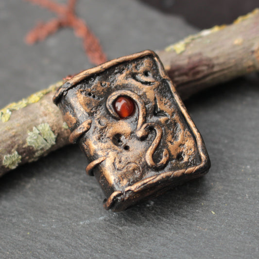 Handmade magic book pendant necklace with carnelian gemstone
