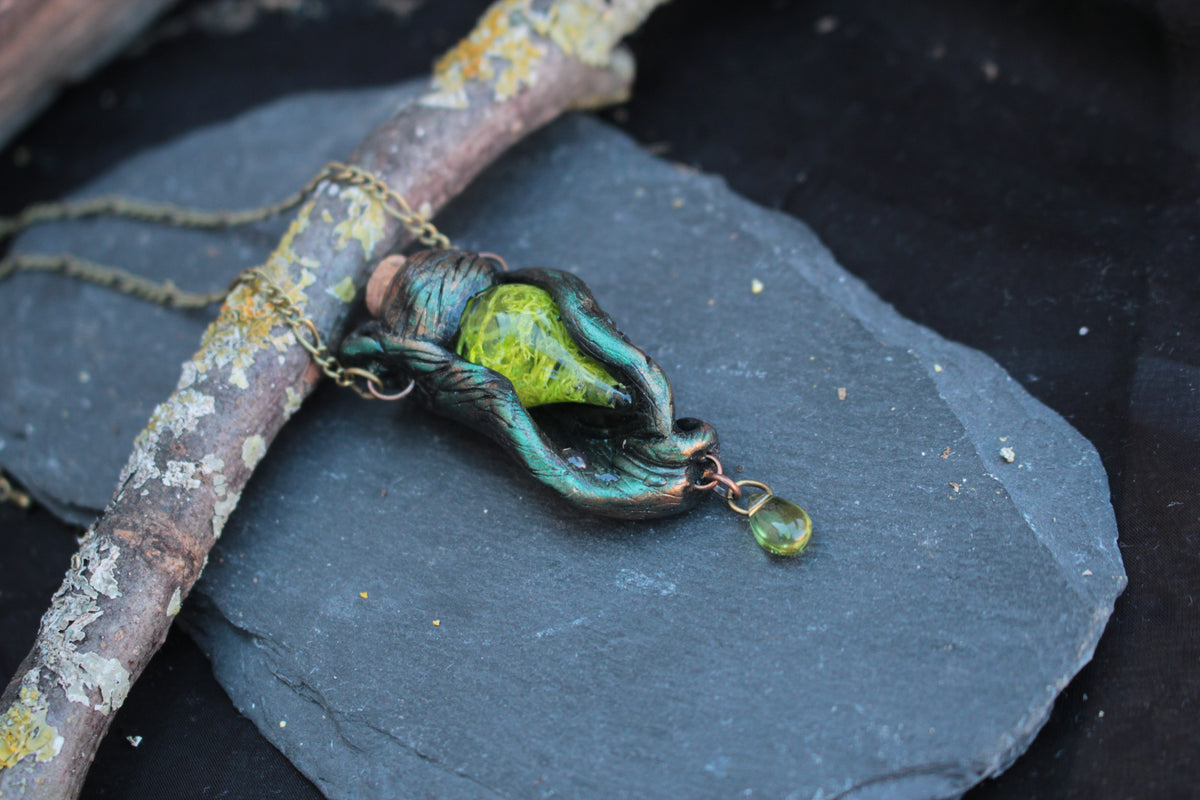 Handmade fantasy forest necklace with mystical green vial and botanical details