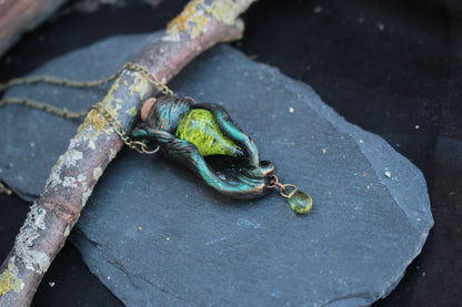 Handmade fantasy forest necklace with mystical green vial and botanical details