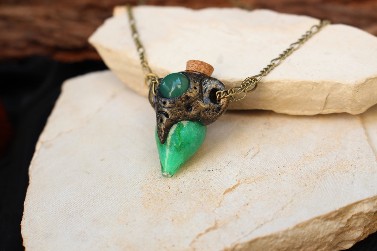 Enchanted green potion necklace with an antique bronze style finish
