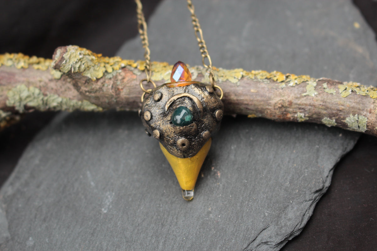 Close-up of a magical green stone fantasy necklace