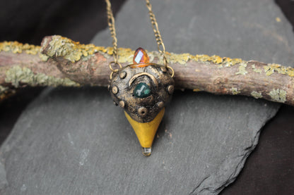 Close-up of a magical green stone fantasy necklace
