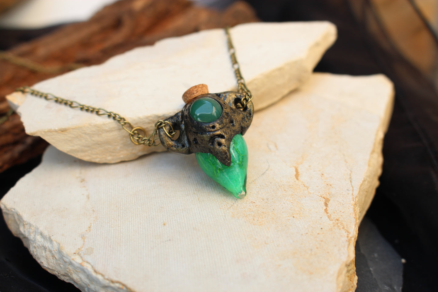 Medieval-inspired handmade potion pendant with glowing details