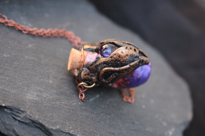 Medieval-inspired fantasy necklace with an ornate bronze potion bottle