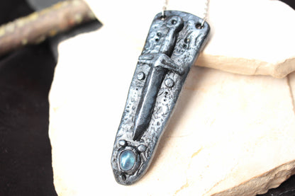 Medieval-inspired sword pendant handmade from polymer clay