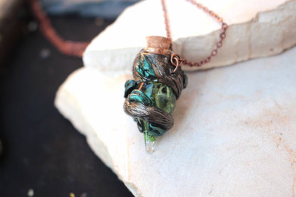 Miniature potion bottle necklace with a whimsical druid and forest-inspired aesthetic