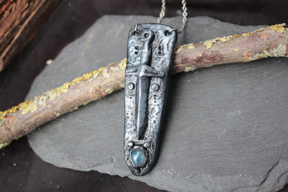 Fantasy sword necklace with an iridescent gemstone