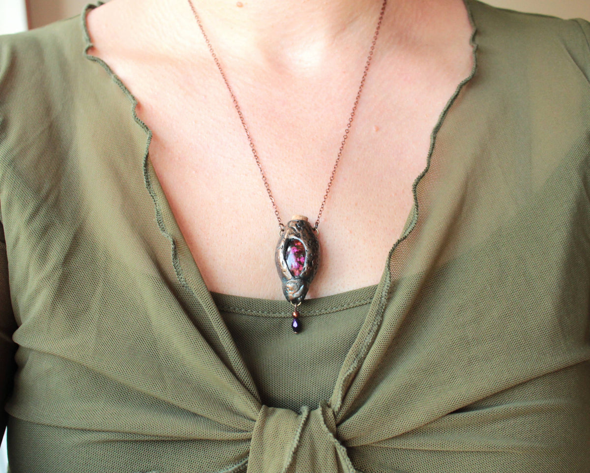 Handmade fantasy necklace featuring artificial moss and a forest-inspired pendant