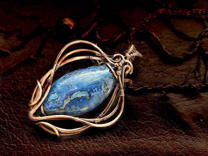 Blue crazy agate pendant with warm copper setting on chain