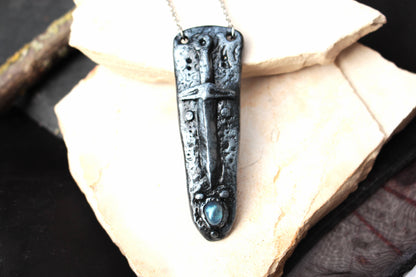 Mystical handmade necklace featuring a detailed fantasy sword