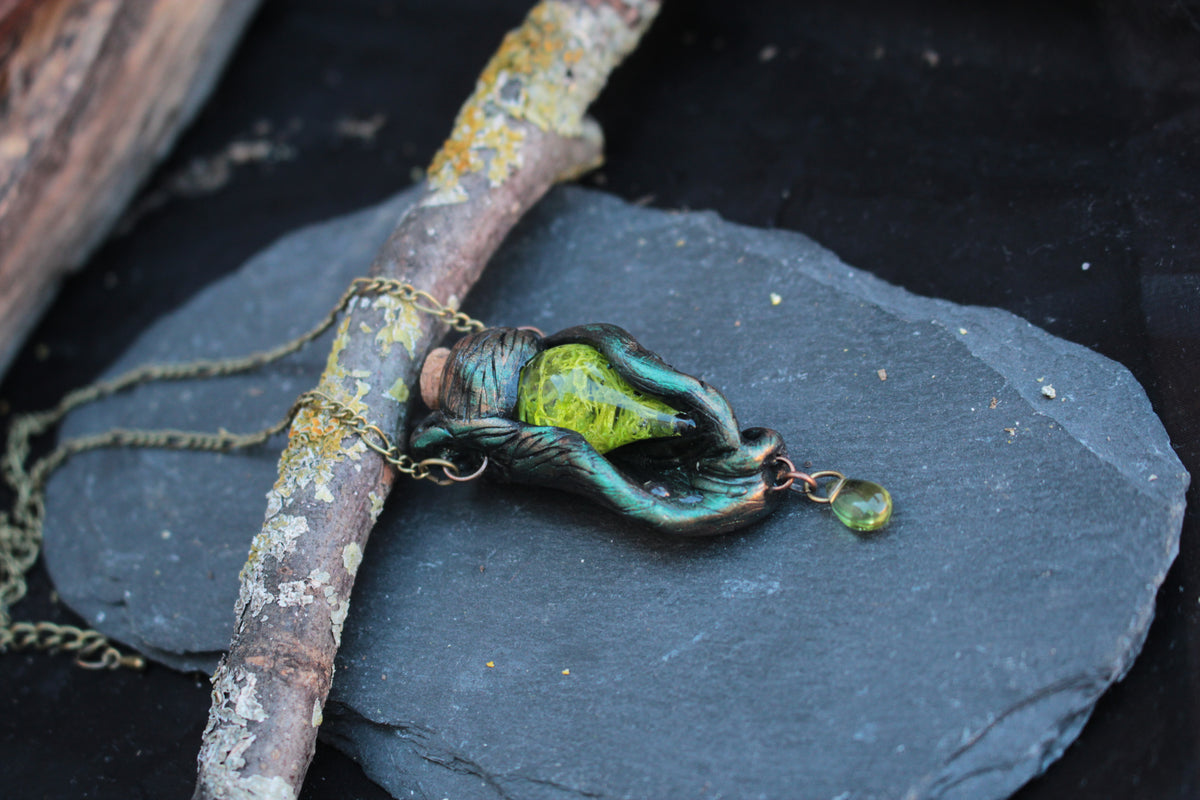 Mystical green vial pendant necklace inspired by ancient forests and druid magic