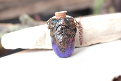 Mystical purple potion pendant handmade from polymer clay and resin