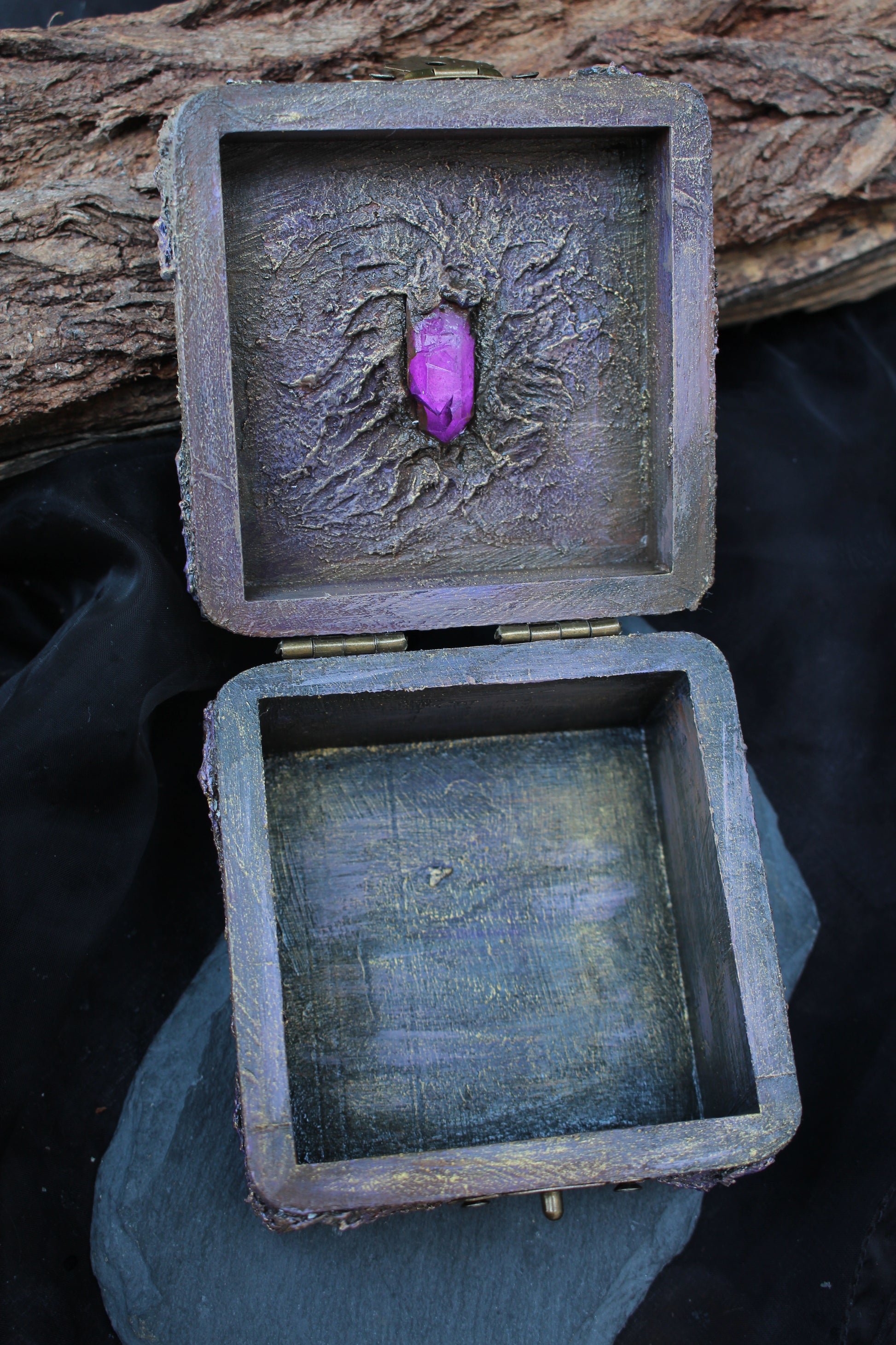 Small wooden jewelry chest with mystical crystal decoration