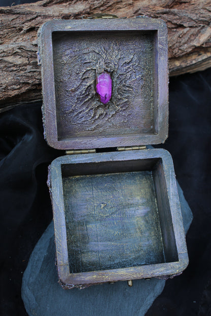 Small wooden jewelry chest with mystical crystal decoration